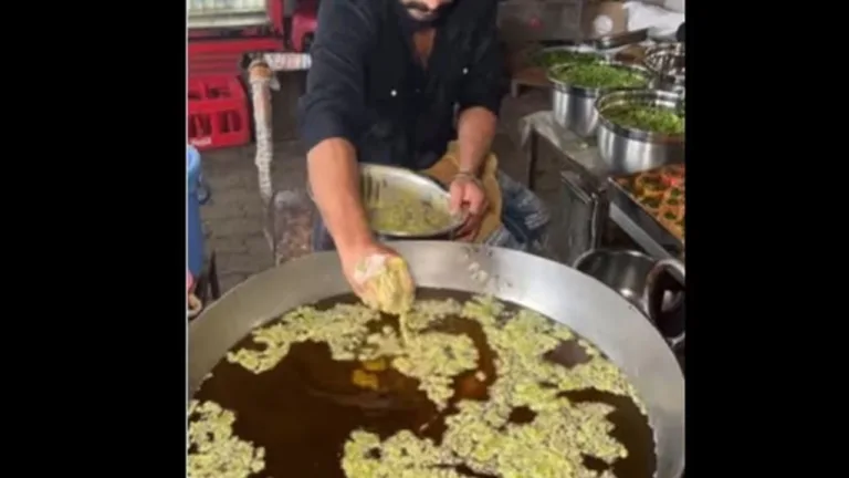 Pakoda Vendor Stirring Food with Bare Hands in Boiling Oil